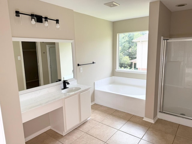 3403 Fox Ct, Pearland, TX 77581 - bathroom featuring vanity, a garden tub, tile patterned flooring, and a shower stall