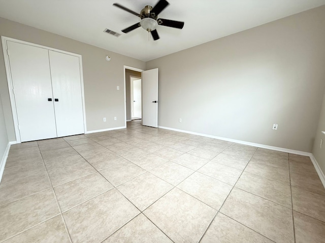 3403 Fox Ct, Pearland, TX 77581 - unfurnished bedroom with tile patterned floors, a closet, and a ceiling fan