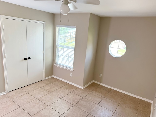 3403 Fox Ct, Pearland, TX 77581 - unfurnished bedroom featuring light tile patterned flooring, a closet, and ceiling fan