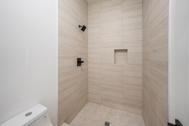 8703 Miller Rd, Magnolia, TX 77354 - bathroom with a tile shower and toilet