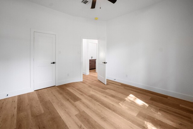 8703 Miller Rd, Magnolia, TX 77354 - unfurnished bedroom featuring light wood-style flooring and a ceiling fan