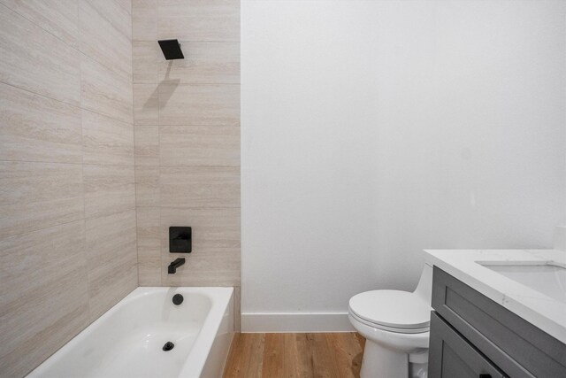 8703 Miller Rd, Magnolia, TX 77354 - full bathroom with vanity, wood finished floors, and  shower combination