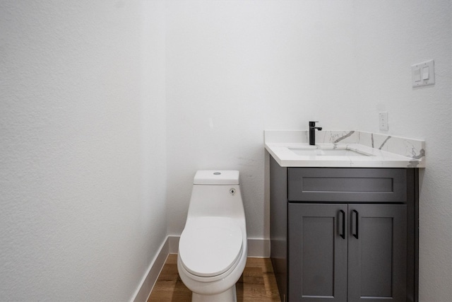 8703 Miller Rd, Magnolia, TX 77354 - half bathroom featuring wood finished floors and vanity