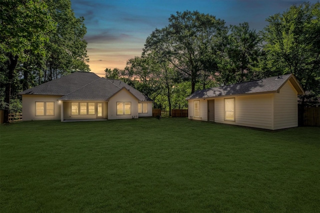 8703 Miller Rd, Magnolia, TX 77354 - rear view of house with an outdoor structure and a shingled roof