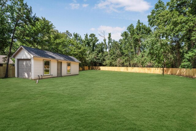 8703 Miller Rd, Magnolia, TX 77354 - fenced backyard with a detached garage and an outbuilding