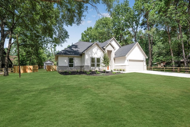 8703 Miller Rd, Magnolia, TX 77354 - view of front of house with stone siding, stucco siding, concrete driveway, and roof with shingles