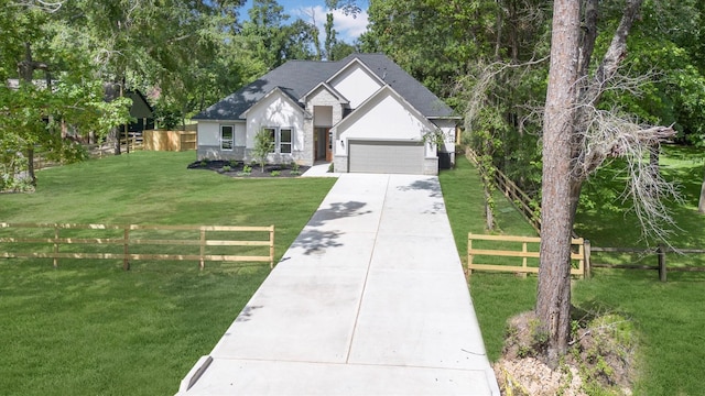 8703 Miller Rd, Magnolia, TX 77354 - ranch-style house featuring driveway, an attached garage, and stucco siding