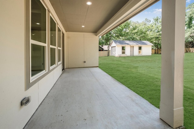 8703 Miller Rd, Magnolia, TX 77354 - view of patio featuring an outbuilding