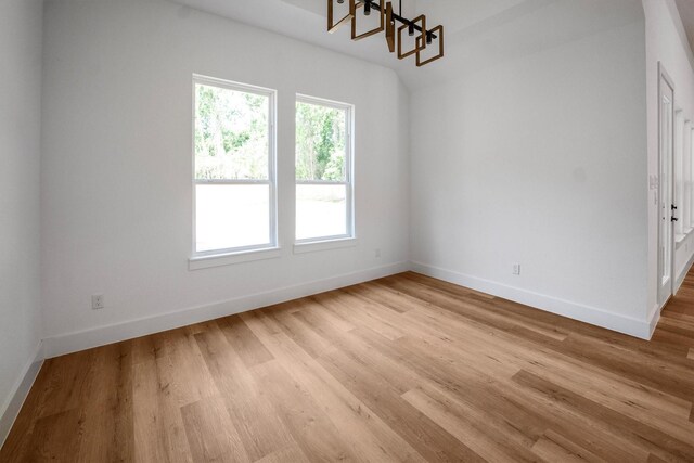 8703 Miller Rd, Magnolia, TX 77354 - unfurnished dining area with light wood-type flooring and a chandelier