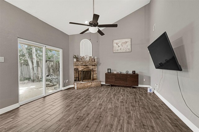 3018 Windy Royal Dr, Houston, TX 77045 - living room featuring a brick fireplace, wood finished floors, ceiling fan, and high vaulted ceiling