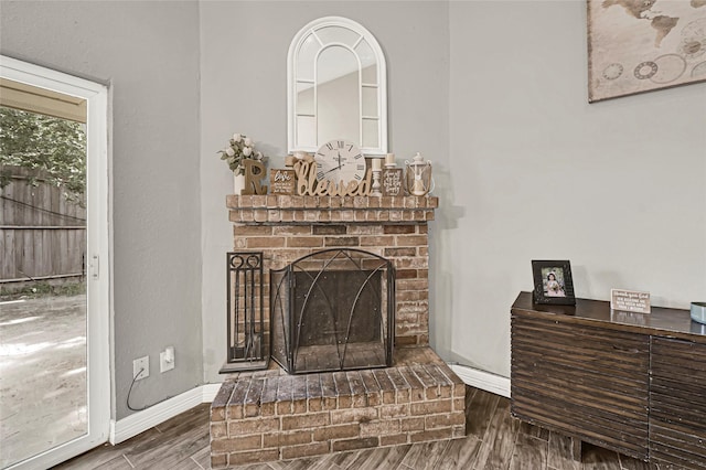3018 Windy Royal Dr, Houston, TX 77045 - detailed view of wood finished floors and a fireplace