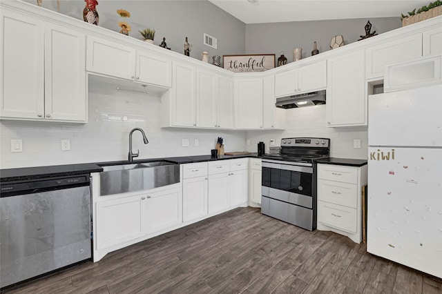 3018 Windy Royal Dr, Houston, TX 77045 - kitchen with stainless steel appliances, under cabinet range hood, decorative backsplash, dark wood-type flooring, and white cabinetry