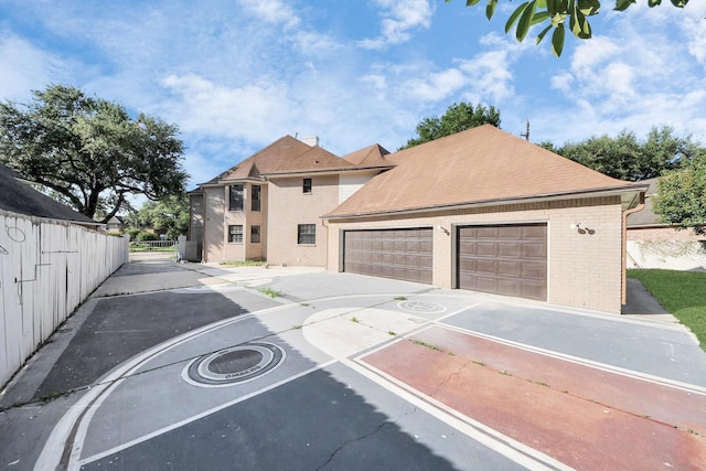 1743 Randons Point Dr, Sugar Land, TX 77478 - view of front of house with brick siding, driveway, and a shingled roof