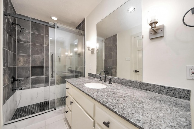 1743 Randons Point Dr, Sugar Land, TX 77478 - full bath with a shower stall, vanity, recessed lighting, and tile patterned flooring