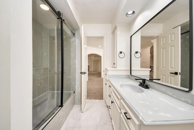 1743 Randons Point Dr, Sugar Land, TX 77478 - full bath featuring shower / bath combination with glass door, vanity, marble look tile flooring, and recessed lighting