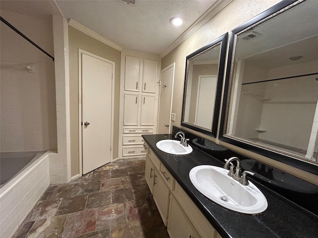 10007 Sagecourt Dr, Houston, TX 77089 - full bath with double vanity, stone finish flooring, crown molding, a textured ceiling, and bathtub / shower combination