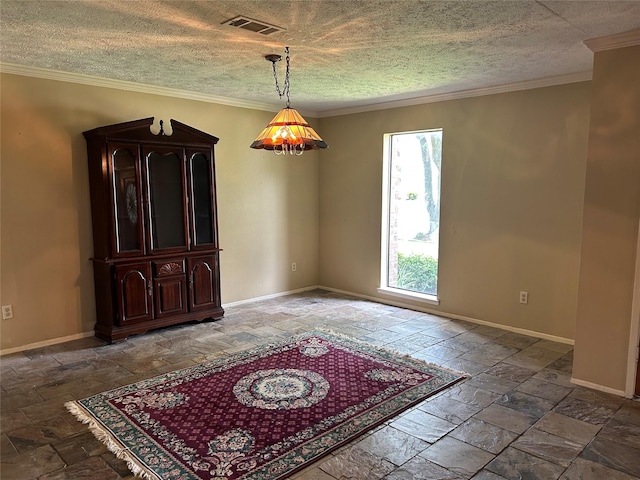 10007 Sagecourt Dr, Houston, TX 77089 - spare room featuring stone tile floors, crown molding, and a textured ceiling