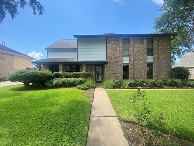 10007 Sagecourt Dr, Houston, TX 77089 - view of front of home with a front lawn and brick siding