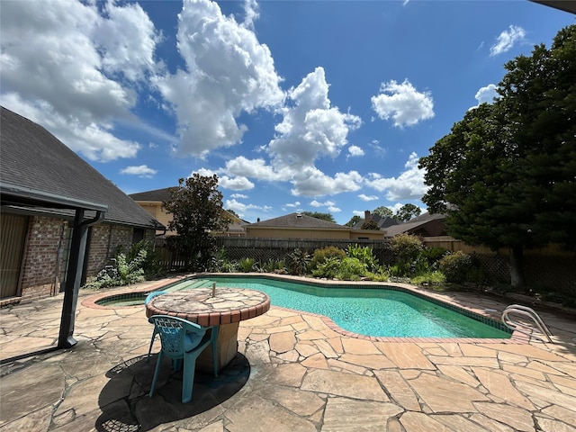 10007 Sagecourt Dr, Houston, TX 77089 - view of pool with a jacuzzi, a patio area, and a fenced backyard