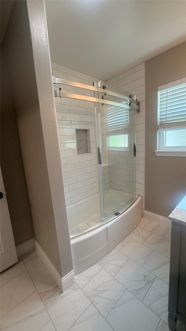 5580 Hooks Ave, Beaumont, TX 77706 - full bathroom with marble look tiles and shower / bath combination with glass door