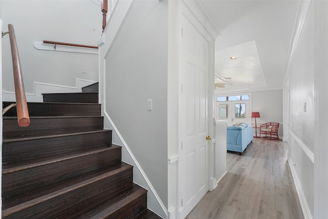 22517 Bay Point Dr, Galveston, TX 77554 - staircase with wood finished floors and baseboards