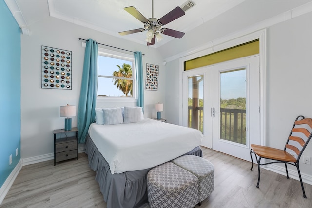 22517 Bay Point Dr, Galveston, TX 77554 - bedroom with access to outside, light wood-style floors, french doors, and a ceiling fan
