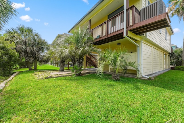 22517 Bay Point Dr, Galveston, TX 77554 - view of green lawn with a wooden deck