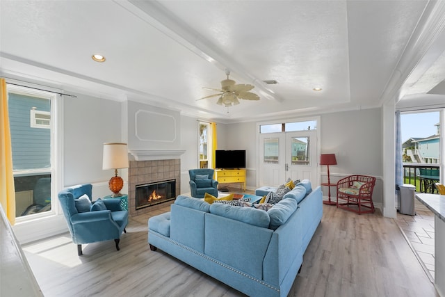 22517 Bay Point Dr, Galveston, TX 77554 - living room with light wood-style floors, a tile fireplace, recessed lighting, and a ceiling fan