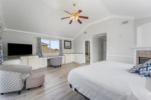 22517 Bay Point Dr, Galveston, TX 77554 - bedroom featuring lofted ceiling, light wood-type flooring, attic access, built in study area, and a ceiling fan