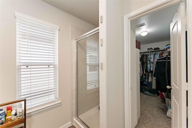 22006 Great Royal Ln, Houston, TX 77073 - bathroom featuring a stall shower and a walk in closet