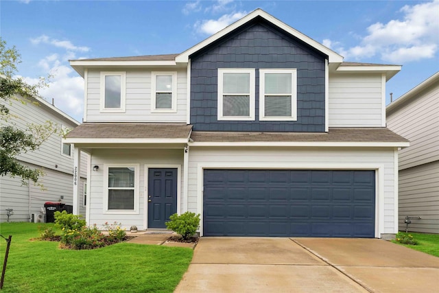 22006 Great Royal Ln, Houston, TX 77073 - view of front of house featuring a garage, concrete driveway, a front lawn, and roof with shingles