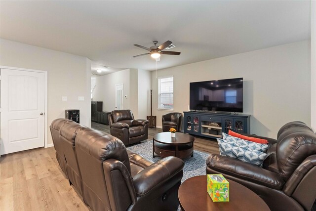 22006 Great Royal Ln, Houston, TX 77073 - living area with ceiling fan and light wood finished floors