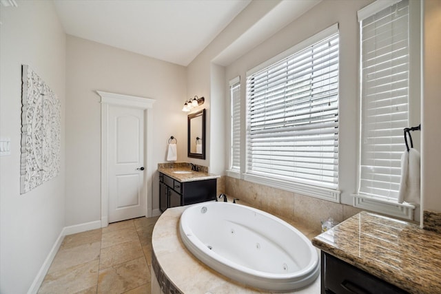 920 Lawrence St Unit D, Houston, TX 77008 - bathroom with vanity, a tub with jets, and stone finish floors