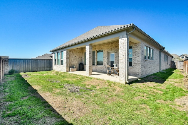 13910 Paseo De La Paz Pl, Cypress, TX 77433 - rear view of house with a fenced backyard, brick siding, and a patio