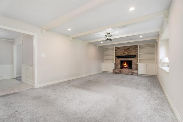 1607 Castlerock Dr, Houston, TX 77090 - unfurnished living room with carpet flooring, beamed ceiling, a brick fireplace, built in shelves, and ornamental molding