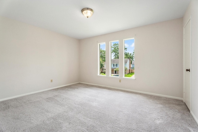 1607 Castlerock Dr, Houston, TX 77090 - carpeted empty room featuring baseboards