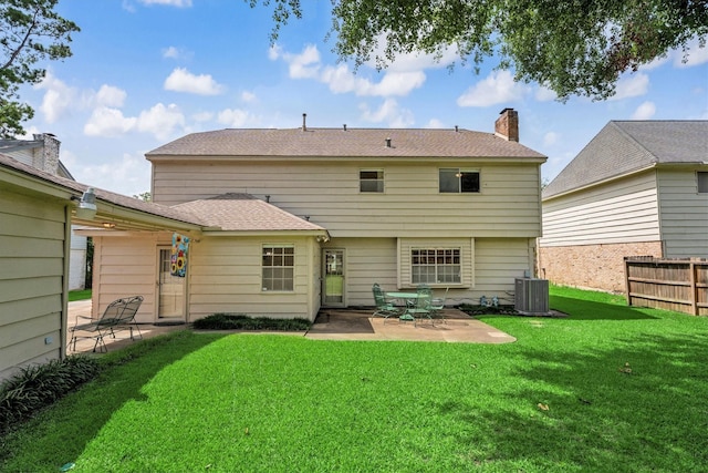 1607 Castlerock Dr, Houston, TX 77090 - rear view of house featuring a patio area, a chimney, and a shingled roof