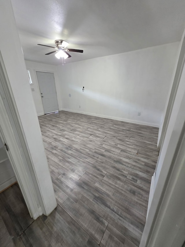 3655 Seabrook St, Houston, TX 77021 - unfurnished room with a ceiling fan and dark wood-type flooring