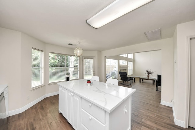 3622 Stratford Town Ln, Sugar Land, TX 77498 - kitchen with dark wood-type flooring, plenty of natural light, and a center island