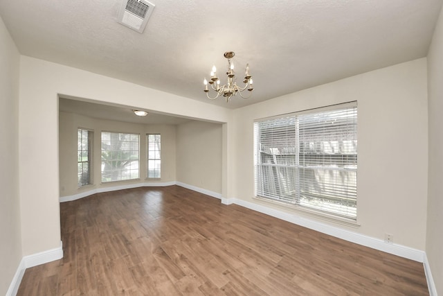 3622 Stratford Town Ln, Sugar Land, TX 77498 - spare room with a chandelier and wood finished floors