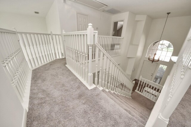 3622 Stratford Town Ln, Sugar Land, TX 77498 - hall featuring an upstairs landing, carpet, attic access, and a chandelier