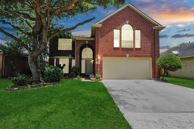 3622 Stratford Town Ln, Sugar Land, TX 77498 - traditional-style house featuring concrete driveway, brick siding, an attached garage, and a front lawn