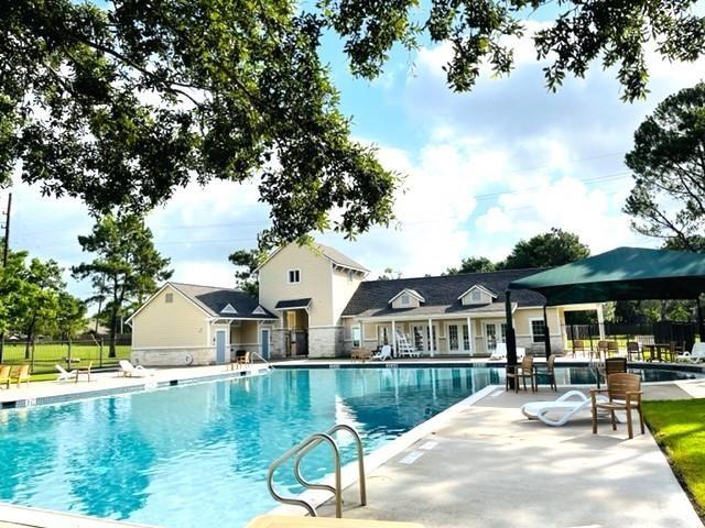 16506 Orchid Mist Dr, Cypress, TX 77433 - community pool featuring a patio