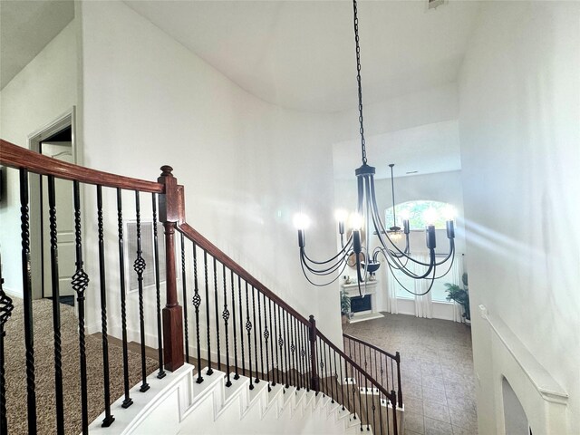 16506 Orchid Mist Dr, Cypress, TX 77433 - stairway with a chandelier