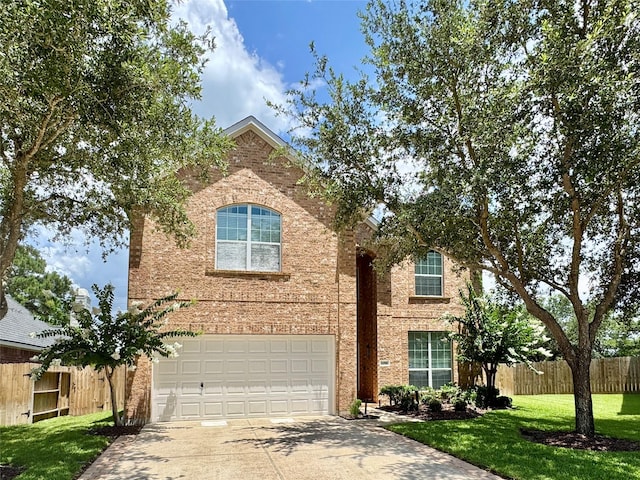 16506 Orchid Mist Dr, Cypress, TX 77433 - traditional-style house with a garage, driveway, and brick siding
