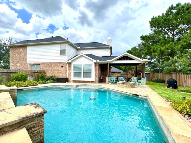 16506 Orchid Mist Dr, Cypress, TX 77433 - view of pool with a fire pit, a patio, and a fenced backyard