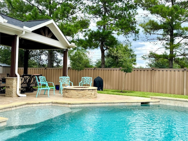 16506 Orchid Mist Dr, Cypress, TX 77433 - view of pool featuring an outdoor fire pit, a patio, and a fenced backyard