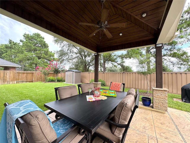 16506 Orchid Mist Dr, Cypress, TX 77433 - fenced backyard featuring a storage shed, a ceiling fan, a patio, outdoor dining area, and grilling area