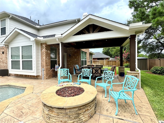 16506 Orchid Mist Dr, Cypress, TX 77433 - view of patio / terrace featuring a fire pit