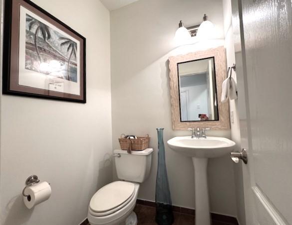 16506 Orchid Mist Dr, Cypress, TX 77433 - half bathroom with toilet and a sink